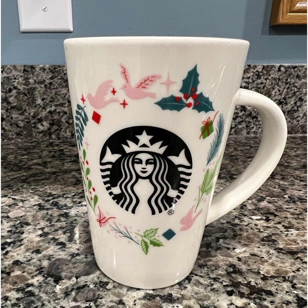 Cute holiday 12oz. Coffee cup with Starbucks holiday theme.